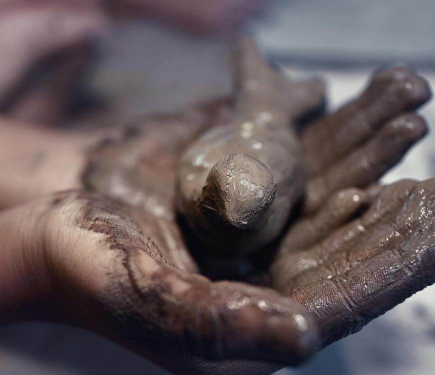 Hands modelling clay