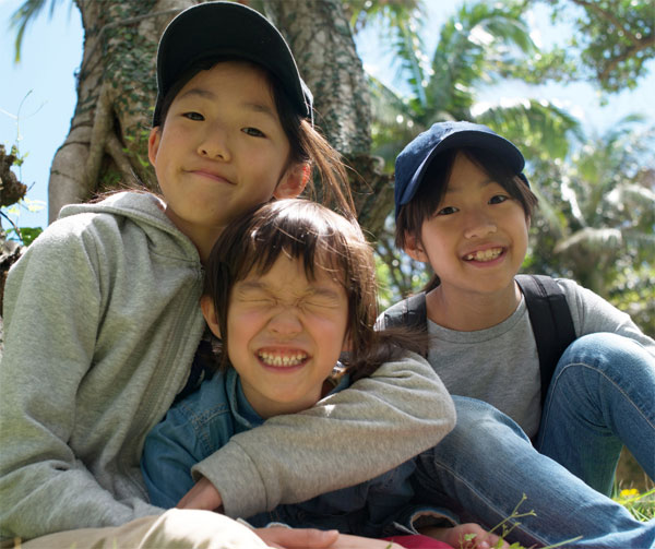 Kids smiling outdoors