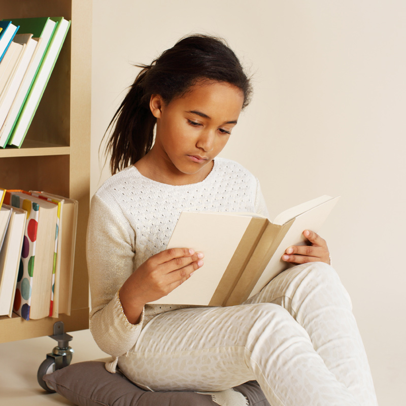 Teenage girl reading a book