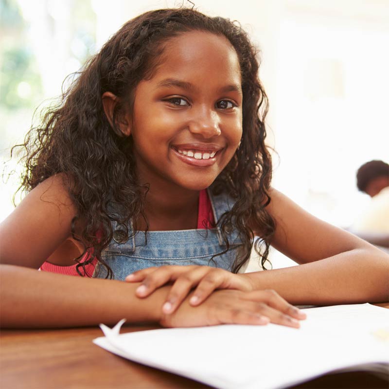 Smiling girl with book