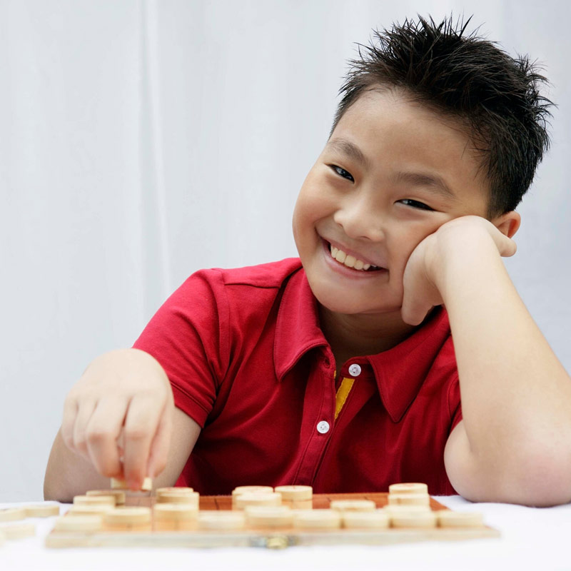 Child playing a board game